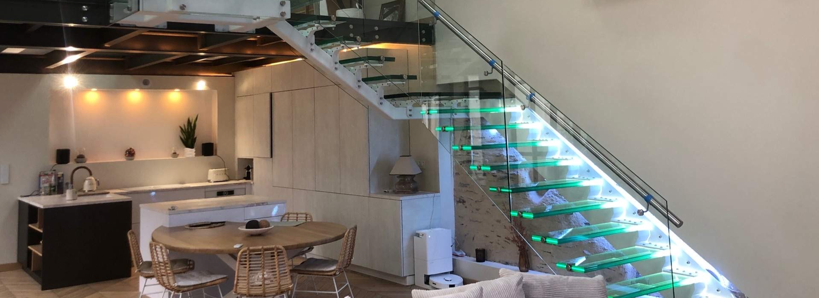 Glass floating staircase with clear glass railing in a modern interior