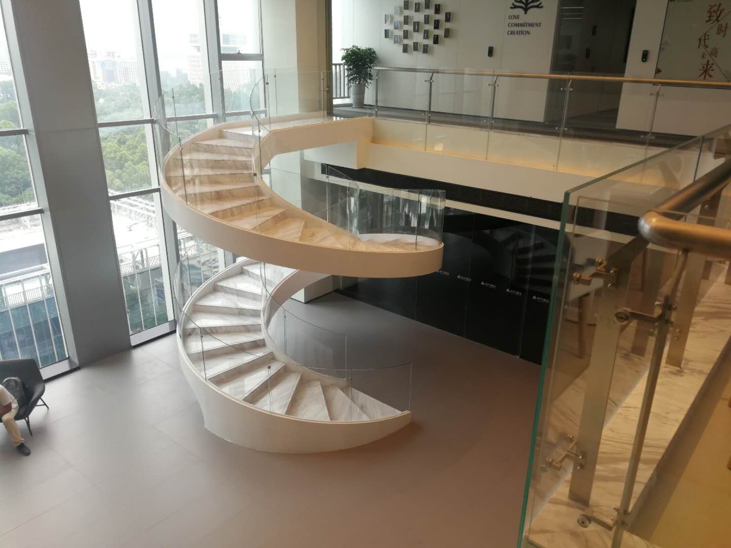 Steel and glass floating staircase in a commercial office showroom