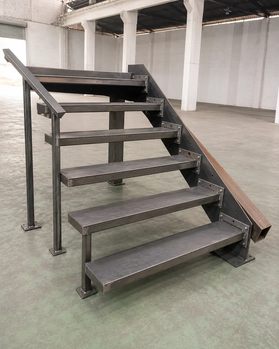 Close-up of welded steel stringer connection for a floating staircase